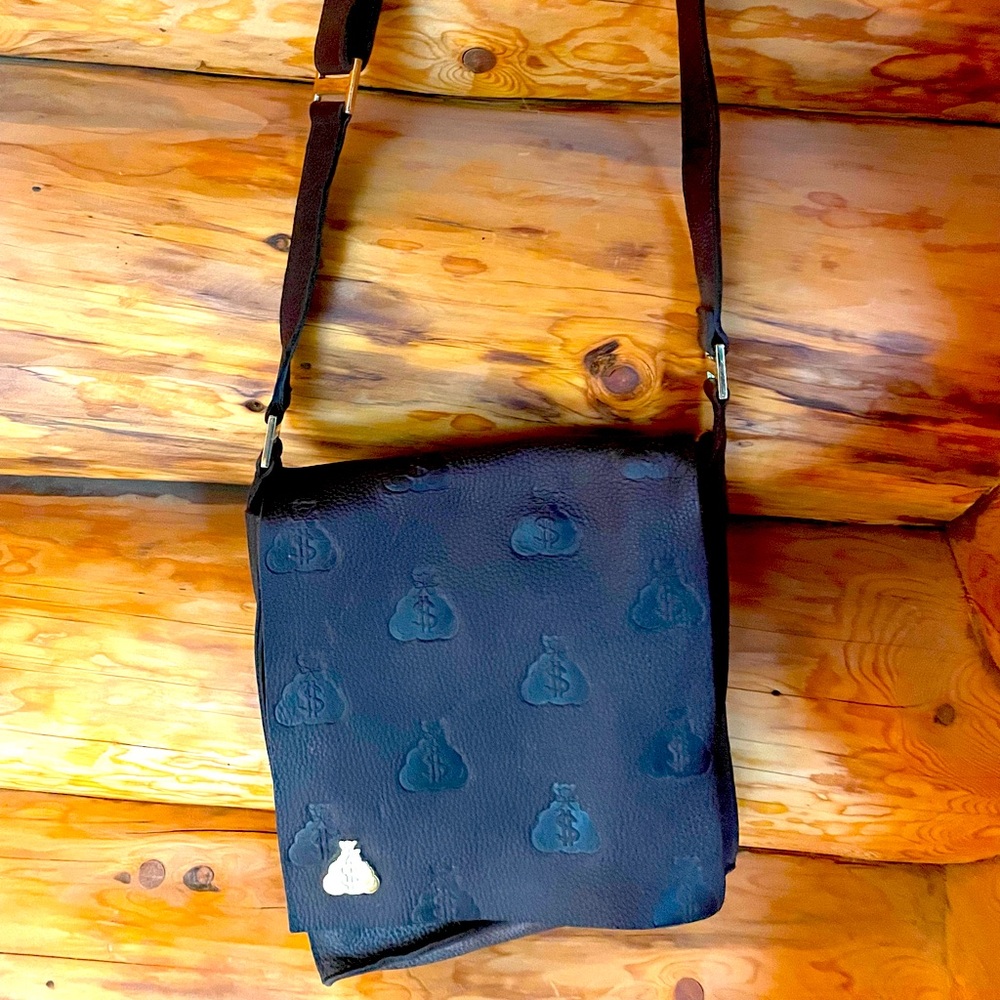 Authentic Gene Simmons from rockband Kiss’ Money Bag messenger bag.